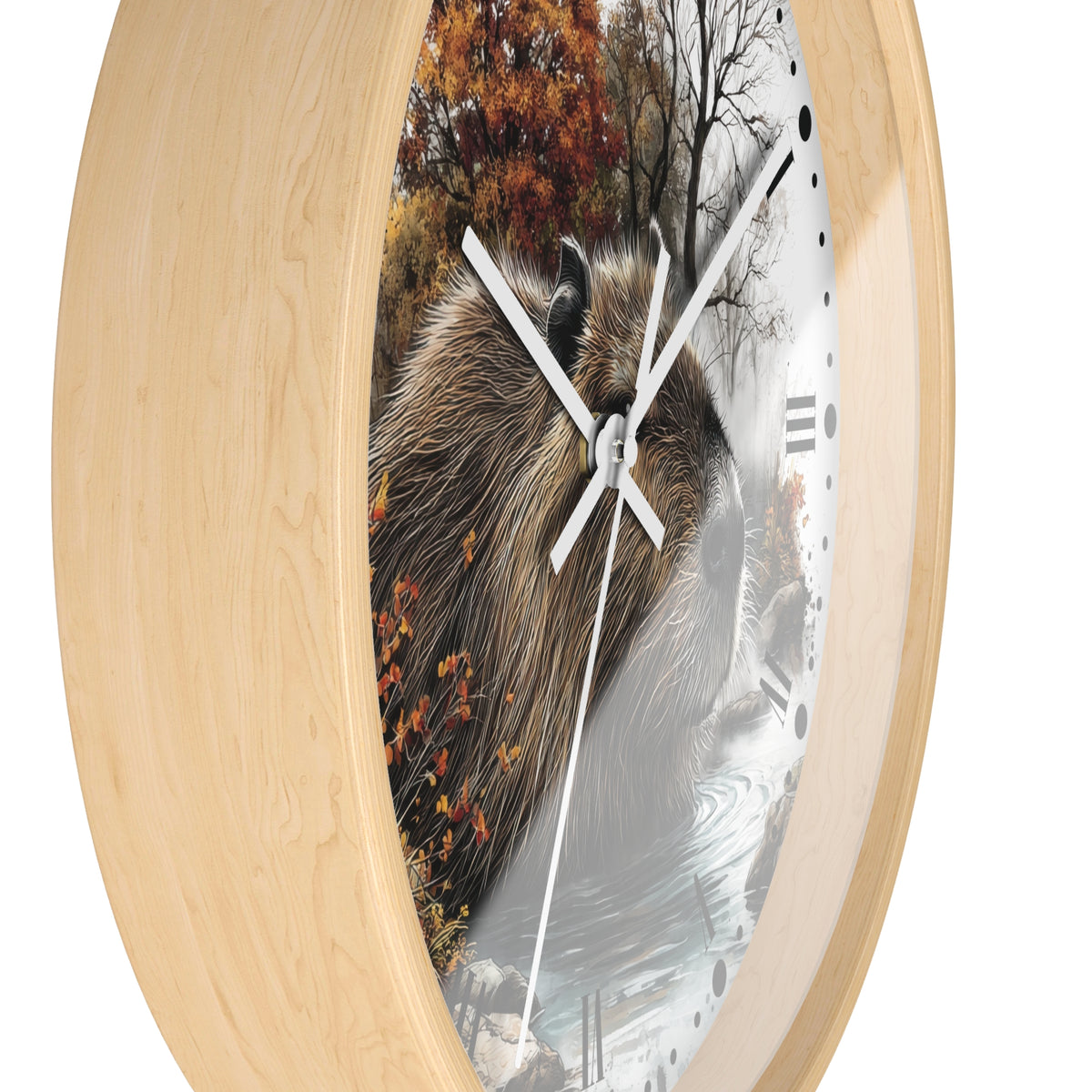 Round wall clock with a light natural wood frame and a printed nature scene featuring a capybara, autumn trees, and a snowy river on the face.
