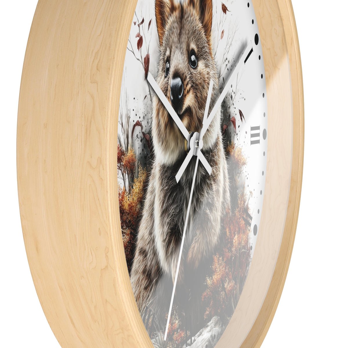 Round wall clock with a light natural wood frame and a printed quokka design on the clock face, shown against a plain white background.