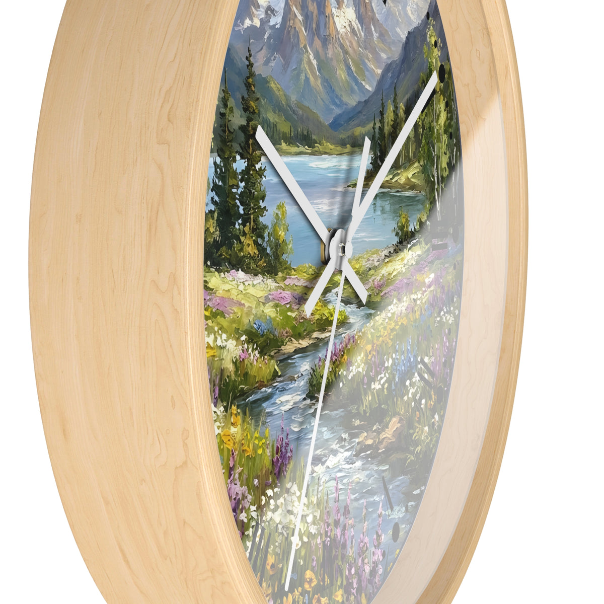 Oval wall clock with a light natural wood frame and a scenic landscape print featuring a mountain lake, pine trees, a winding stream, and wildflowers, with white clock hands.