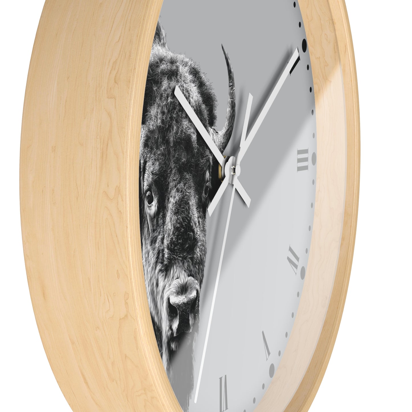 Round wall clock with a light natural wood frame and a white face featuring a black-and-white close-up photograph of a bison.