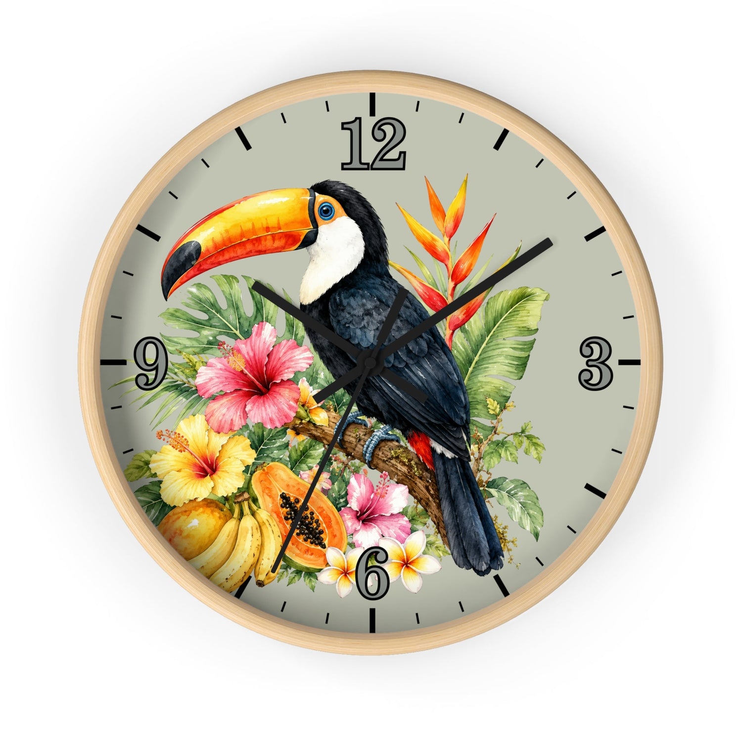 A round wall clock with a light wood frame and a tropical illustration on the dial, featuring a black-and-white toucan with a bright orange beak, pink and yellow 