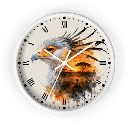 A round wall clock with a white frame and a printed design featuring a bird of prey over an African savanna sunset at dusk. The clock face has a warm off-white background with black Roman numerals and white clock hands.