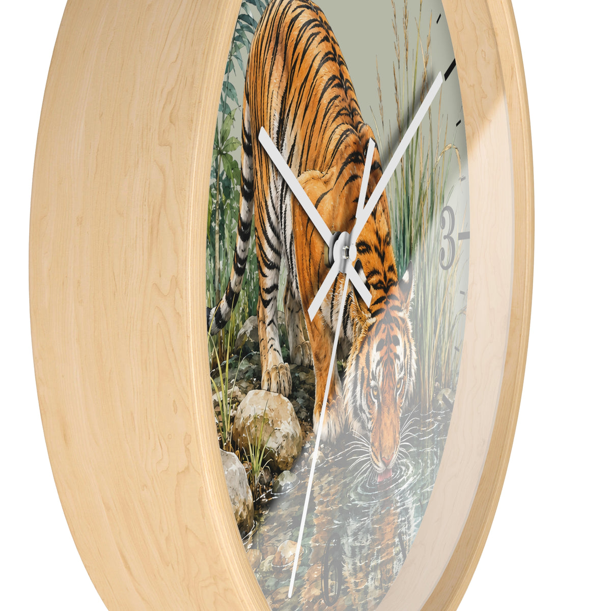 Round wall clock with a light natural wood frame and a printed tiger drinking water scene on the face, shown against a plain white background.