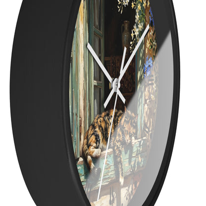 Round wall clock with a black frame and a printed scene on the face showing a cat resting on a weathered wooden windowsill, photographed against a plain white background.
