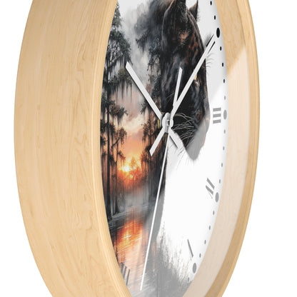 Round wall clock with a light natural wood frame and a split-face design: one half shows a black panther, the other half shows a misty forest at sunset. White clock hands and black Roman numerals are visible against a plain white background.