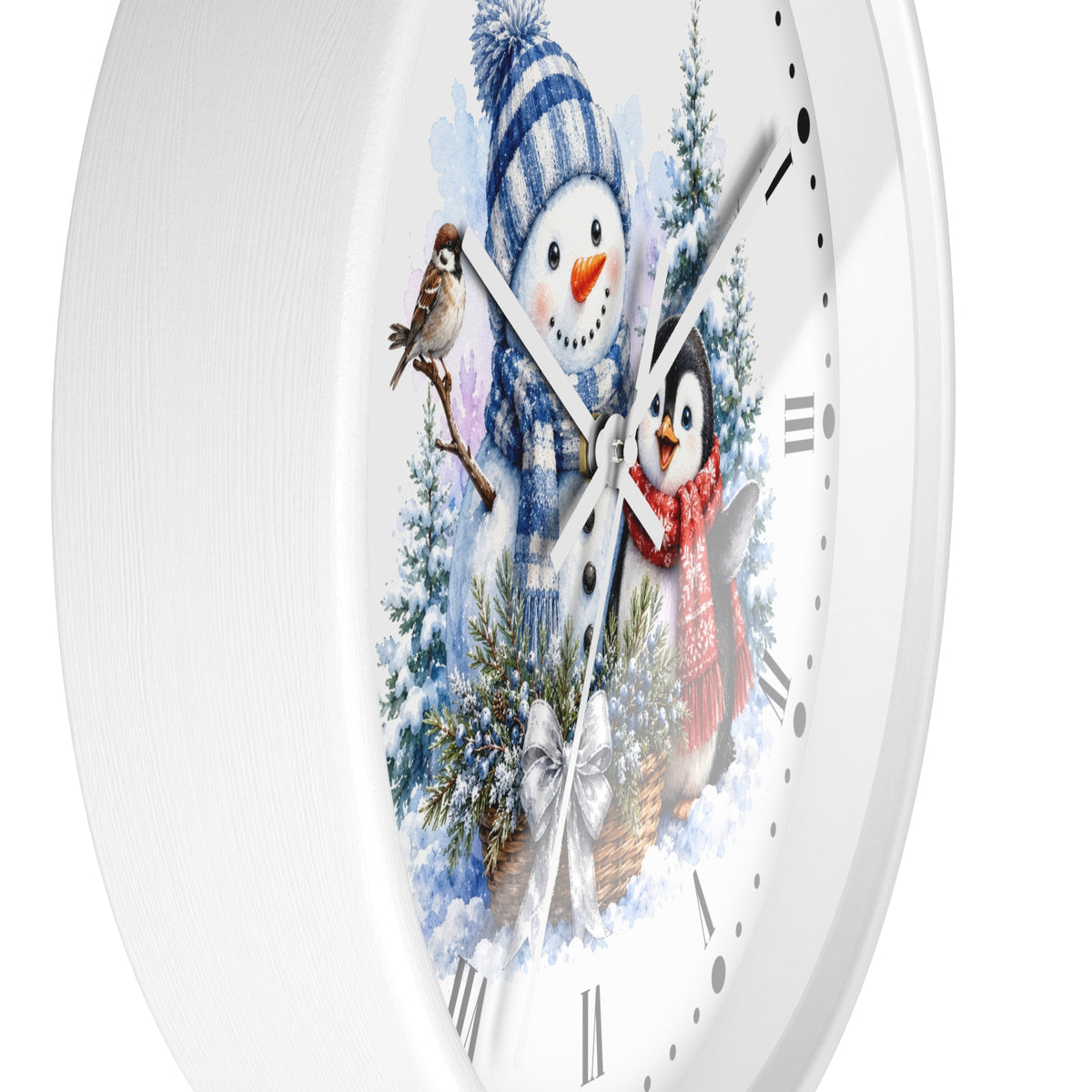 A white round wall clock with a winter-themed illustration on the face, featuring a snowman in a blue striped hat and scarf, a penguin in a red scarf, evergreen trees, and a small bird.