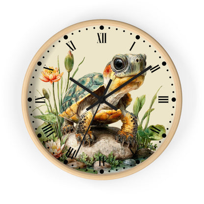 Round wall clock with a light wood frame and a vintage-style illustration of a turtle on the face, surrounded by flowers and greenery, with black Roman numerals and hands on a white background.