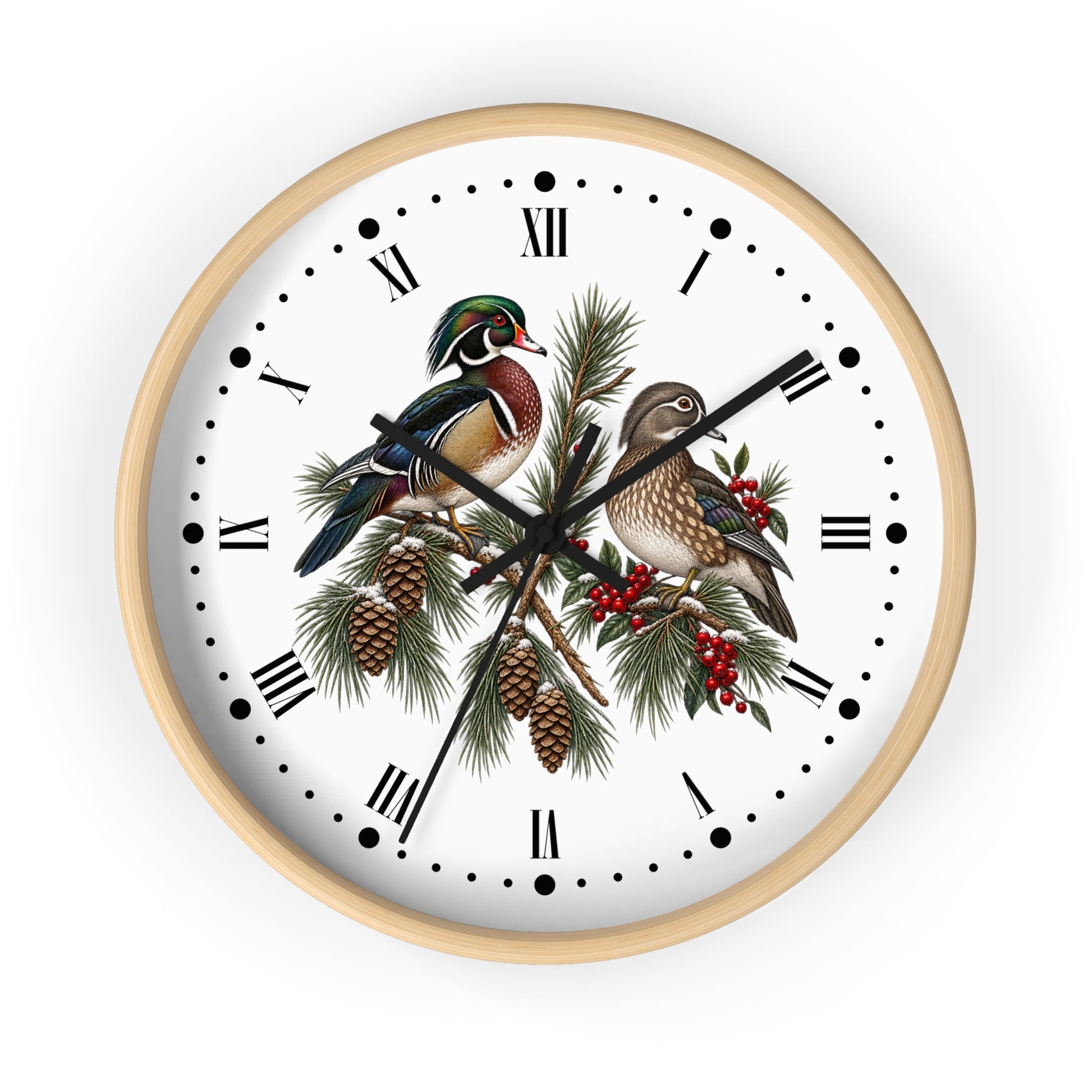 Round wall clock with a light wood frame and a white face featuring two detailed wood ducks perched on pine branches with pinecones and red berries, set against a plain white background.