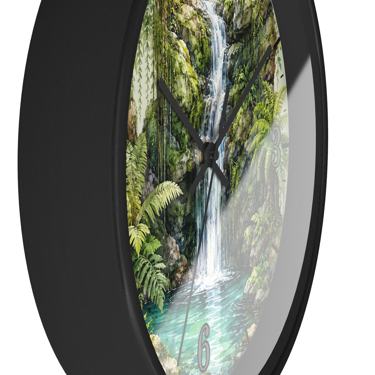 A round wall clock with a black frame and a printed scenic face showing a lush green waterfall in a tropical forest, photographed against a plain white background.