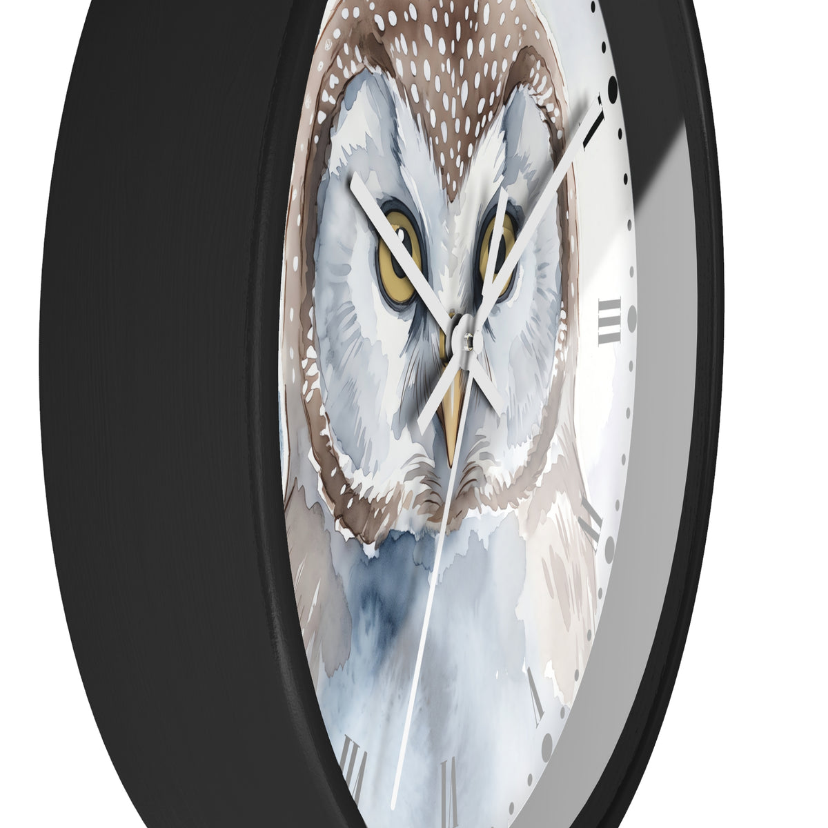 A close-up of a round wall clock with a black frame and a watercolor-style owl face on the dial. The owl has white, gray, brown, and blue tones with yellow eyes, and the clock hands are white and gold.