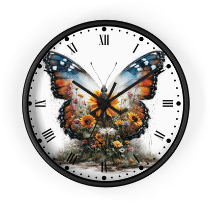 A round wall clock with a black frame and a white face featuring a large colorful butterfly over wildflowers, with black Roman numerals and hands.