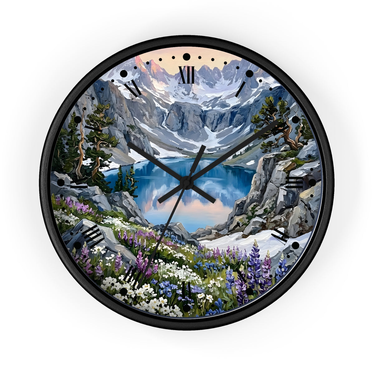 A round wall clock with a black frame and a scenic mountain landscape printed on the face, featuring a blue lake, snowy peaks, rocky cliffs, and wildflowers. Roman numerals mark the hours, and the clock is centered on a plain white background.
