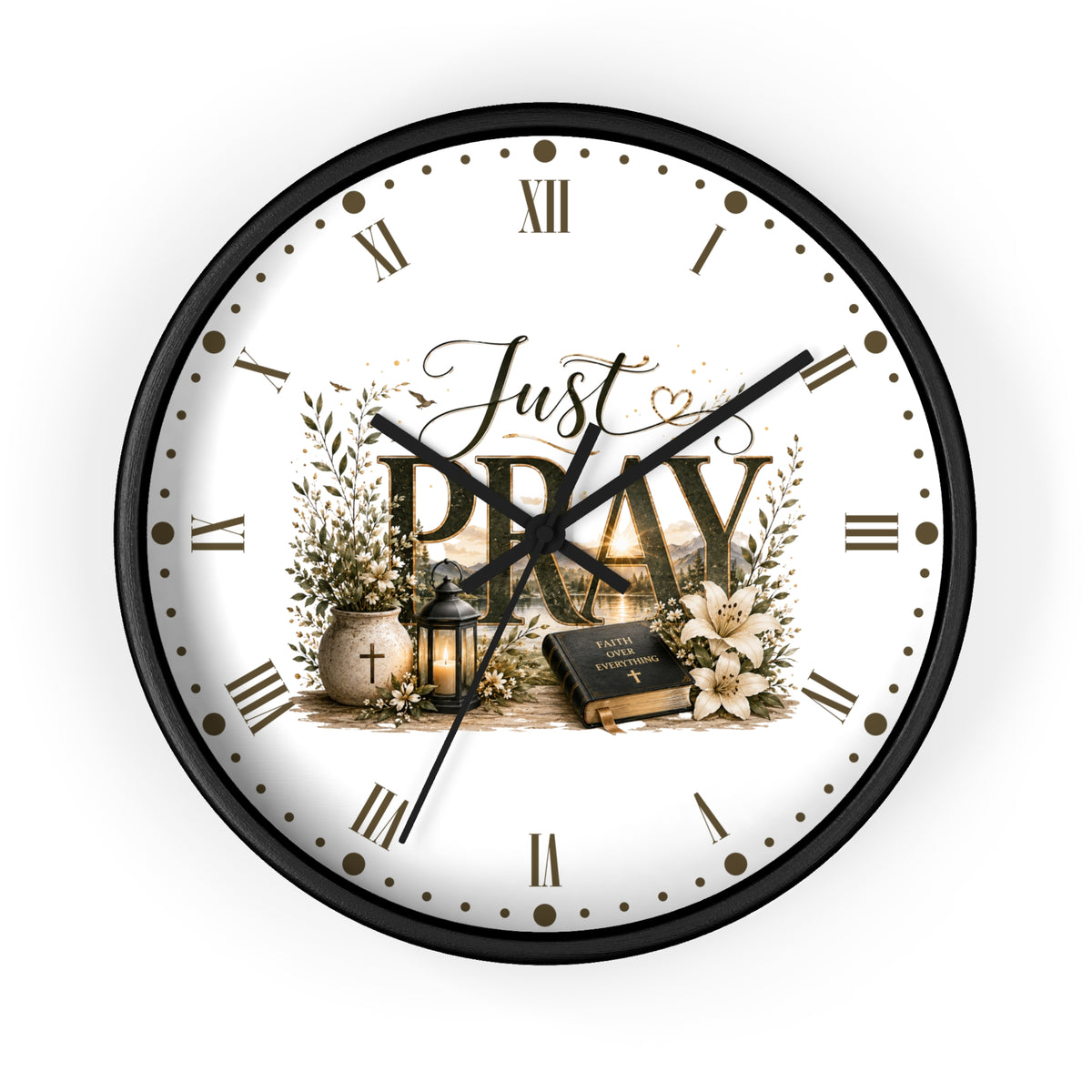 A round wall clock with a black frame and a white face featuring the words 'Just PRAY' in large letters, surrounded by floral and decorative illustrations. The clock is shown against a plain white background.