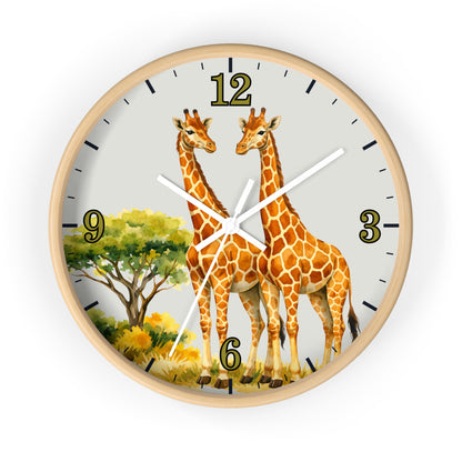 A round wall clock with a light natural wood frame, featuring an illustration of two giraffes and a tree on the clock face, with black numerals and white hands.