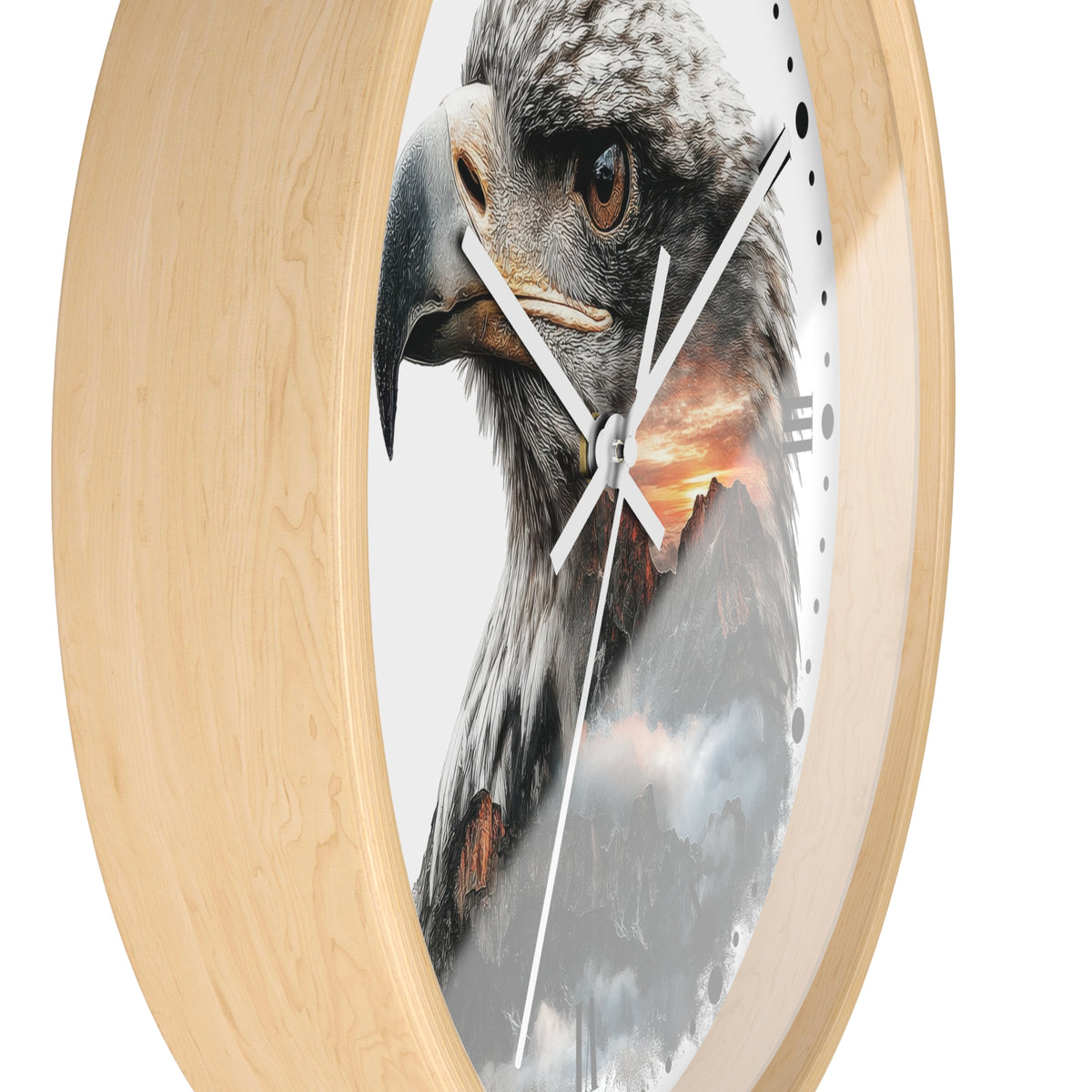 Round wall clock with a light natural wood frame and a printed face featuring a close-up eagle head over a mountain sunset scene.