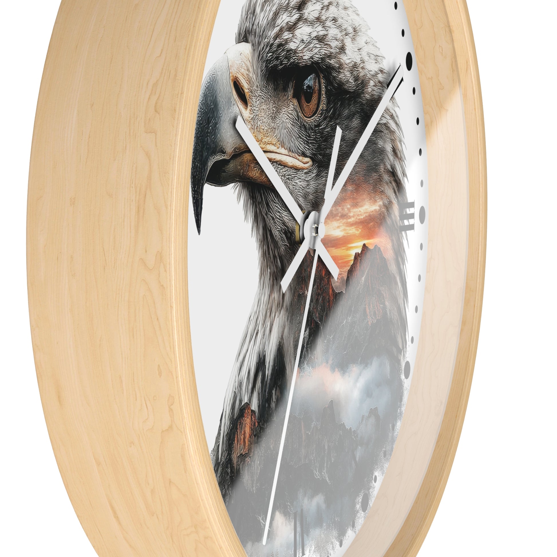 Round wall clock with a light natural wood frame and a printed face featuring a close-up eagle head over a mountain sunset scene.