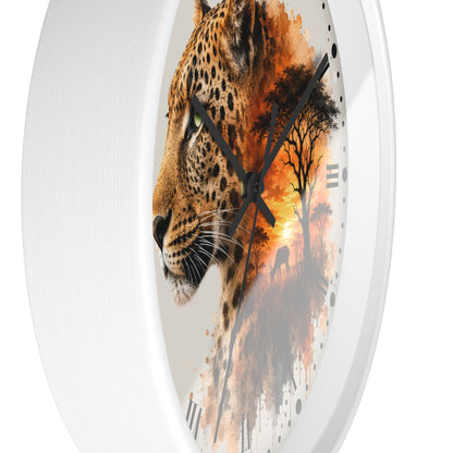 Round wall clock with a white frame and a printed design of a leopard profile merging into an African savanna sunset scene, with black hands and Roman numerals.