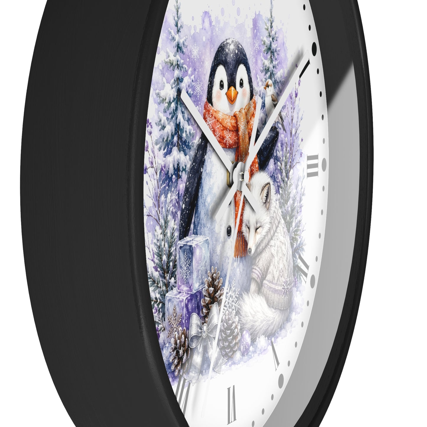 A round wall clock with a black frame and a white face featuring a winter illustration of a penguin in a red scarf and a white fox among snowy trees.