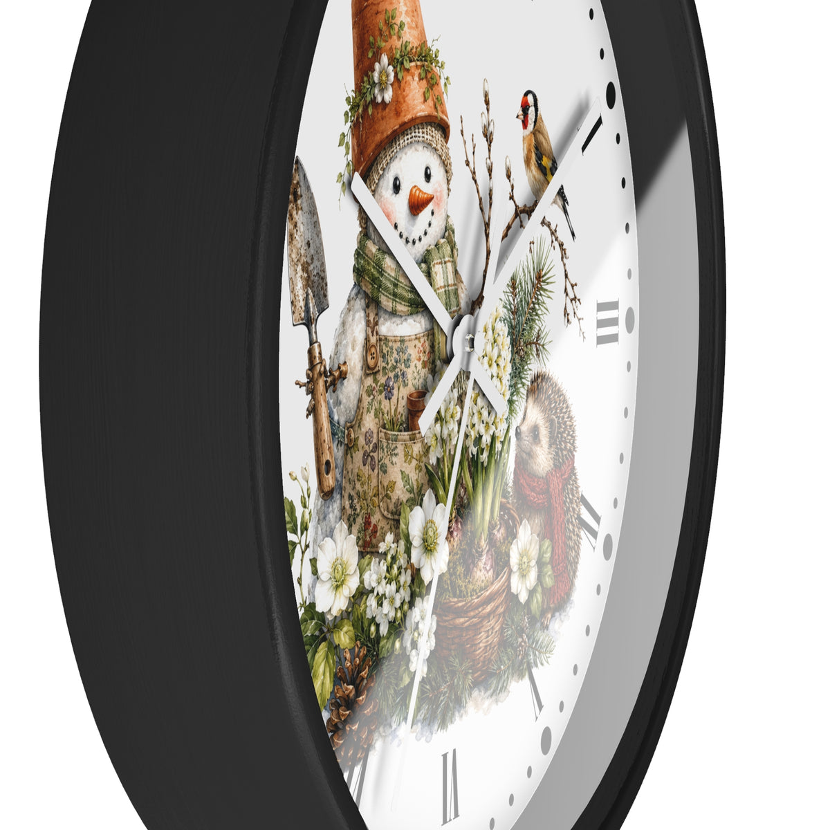 A close-up of a round wall clock with a black frame and a white face featuring a whimsical winter garden illustration. The design includes a snowman in a gardening outfit with a flower pot hat, a small bird, white flowers, and a hedgehog.