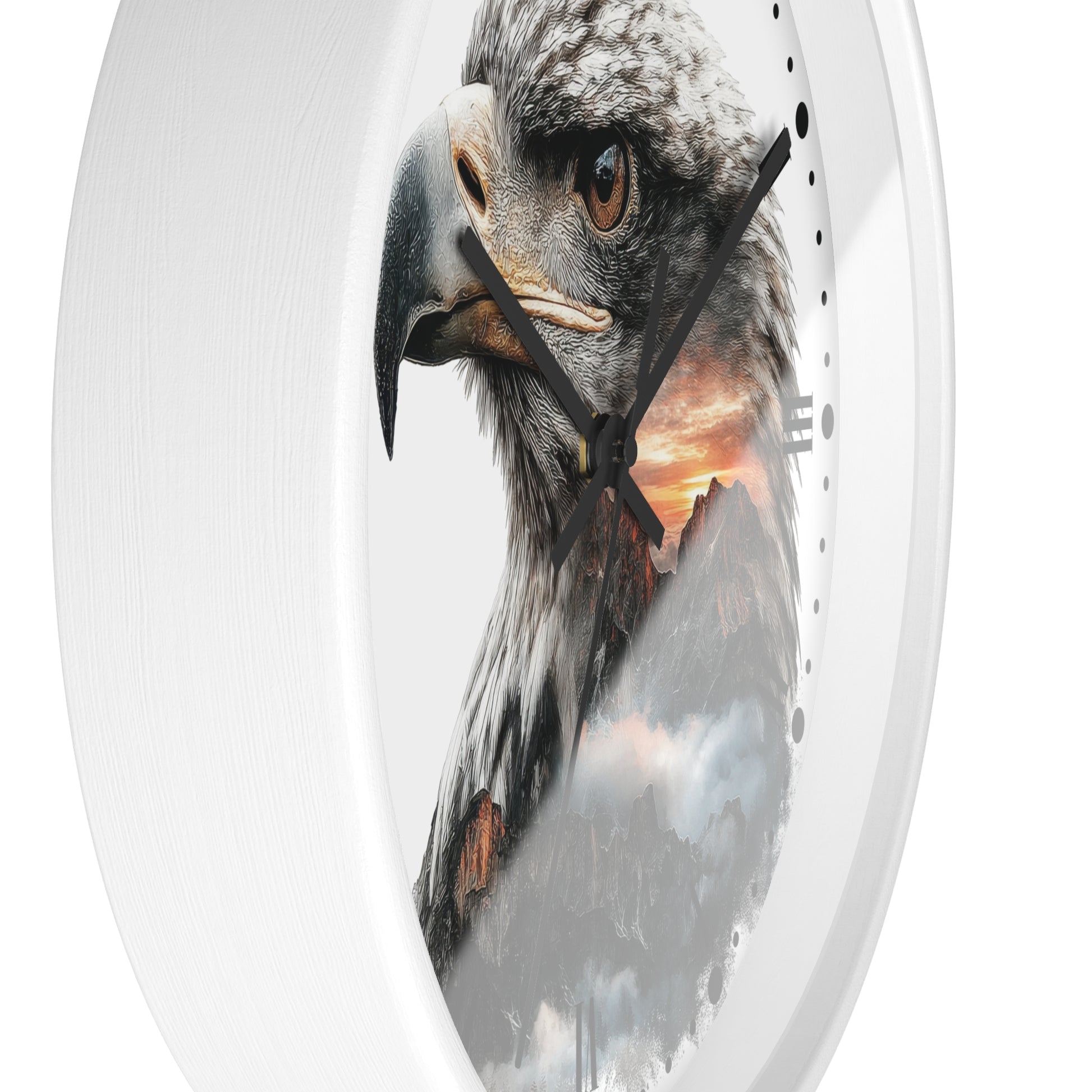 Oval wall clock with a white frame and a printed design of a bald eagle over mountains and a sunset, shown against a plain white background.