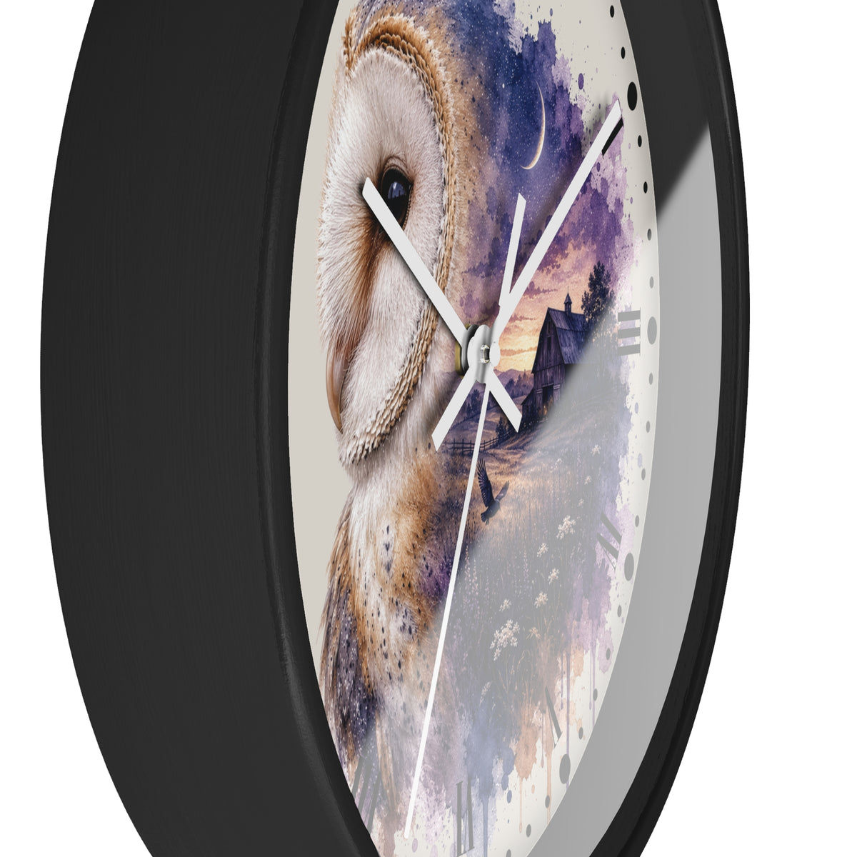 A round wall clock with a black frame with white hands and a printed owl artwork on the face. The design shows a large white and brown owl over a purple and blue watercolor landscape with a house and moon.