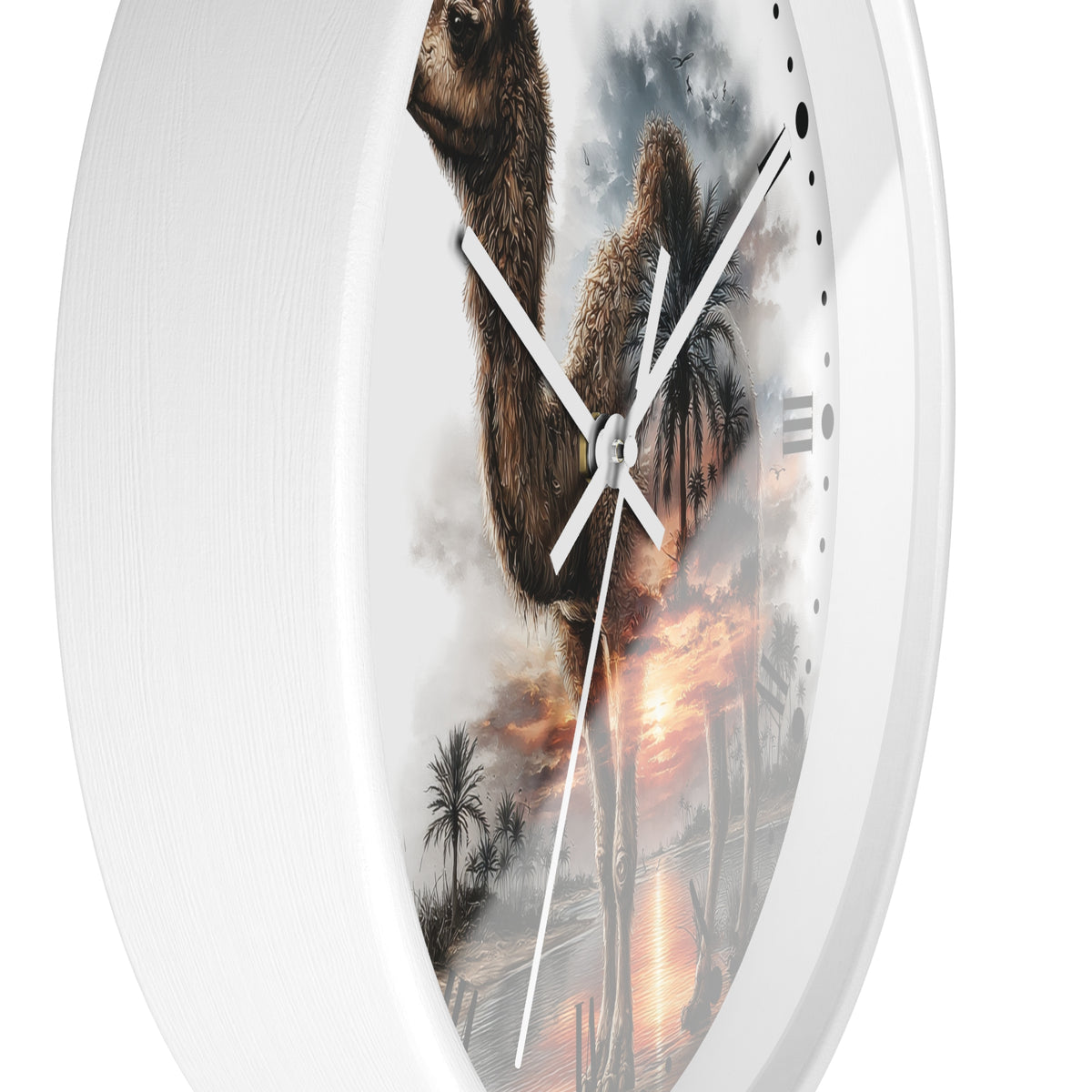 Oval wall clock with a white frame and a printed design of a camel walking through a desert landscape at sunset, shown against a plain white background.