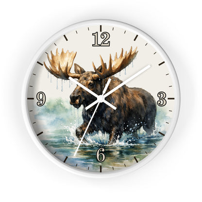 A round wall clock with a white frame and a printed illustration of a moose wading through water, with black Arabic numerals and clock hands on a white background.