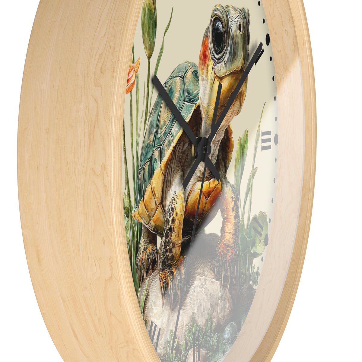 Round wall clock with a light natural wood frame and a printed turtle illustration on the face, shown against a plain white background.