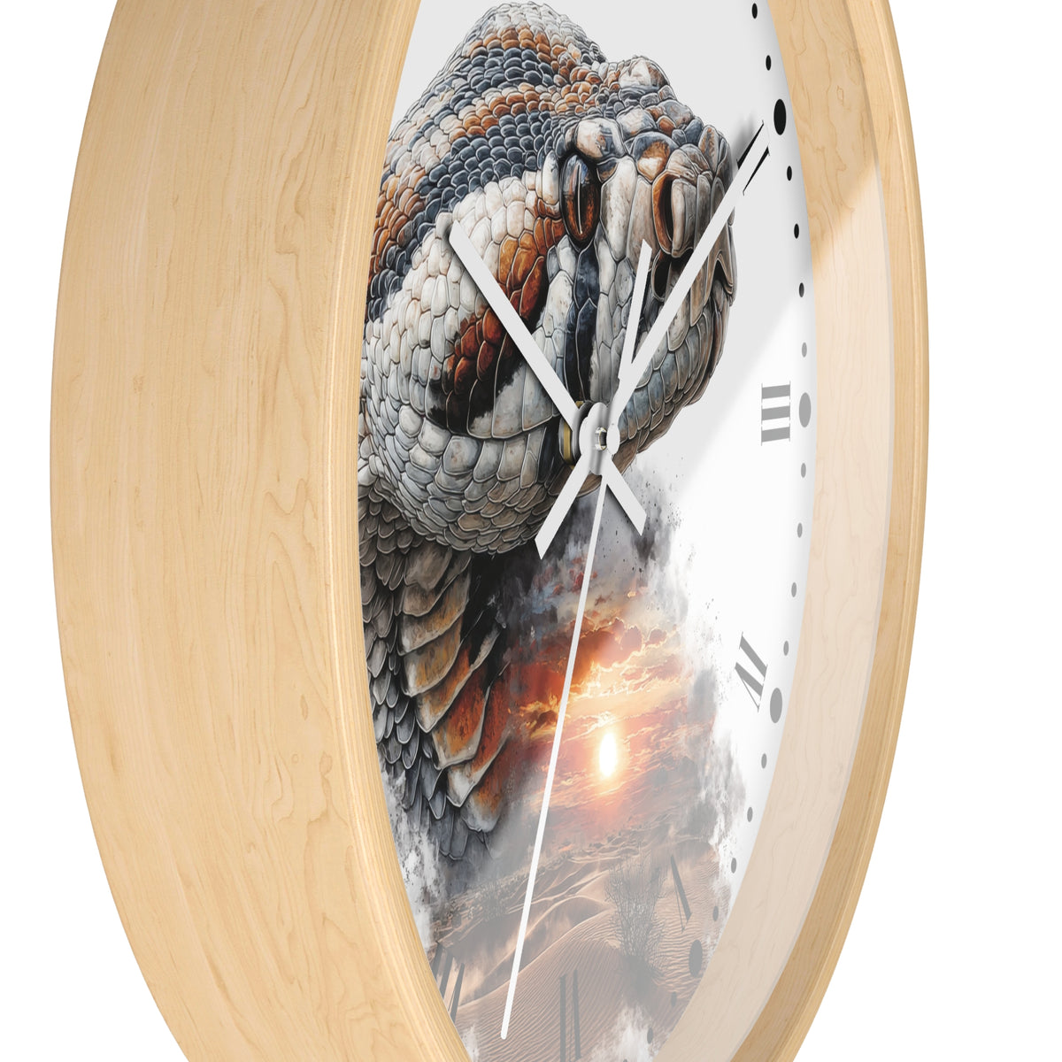 Round wall clock with a light natural wood frame and a printed design of a large snake head over a desert sunset scene on the clock face.