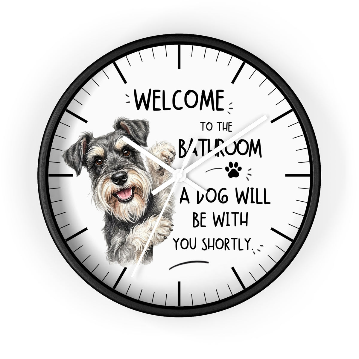 A round wall clock with a black frame and a white face, featuring a hand-drawn Schnauzer dog illustration and the humorous text 'WELCOME TO THE BATHROOM A DOG WILL BE WITH YOU SHORTLY.'.
