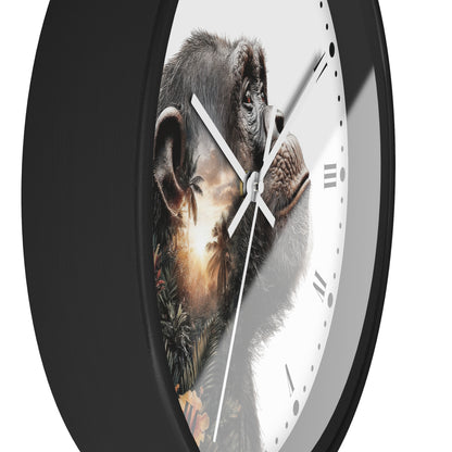 A close-up of a round wall clock with a black frame and a white face featuring a detailed chimpanzee portrait with a sunset landscape printed behind it.