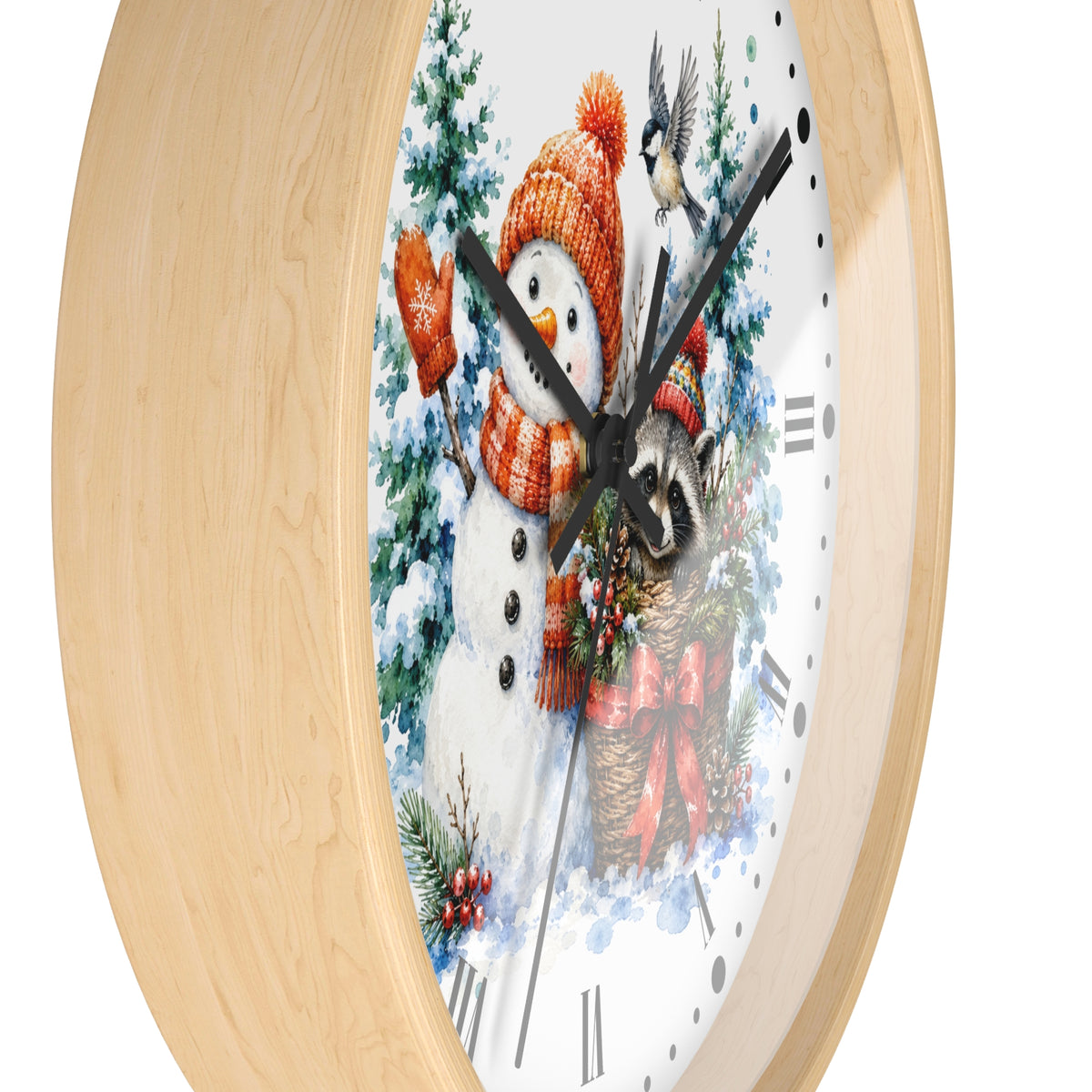 A round wall clock with a light natural wood frame and a white face featuring a winter holiday illustration of a snowman in an orange knit hat and scarf, surrounded by pine trees and a bird.