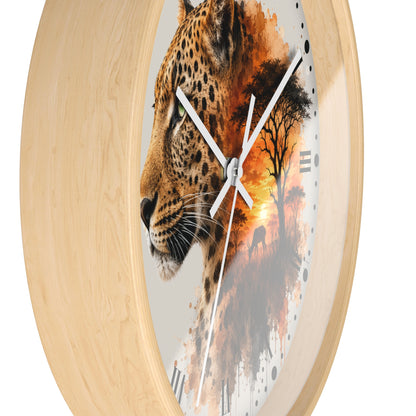 Round wall clock with a light natural wood frame and a printed design on the face showing part of a leopard on the left and an African savanna sunset scene on the right.
