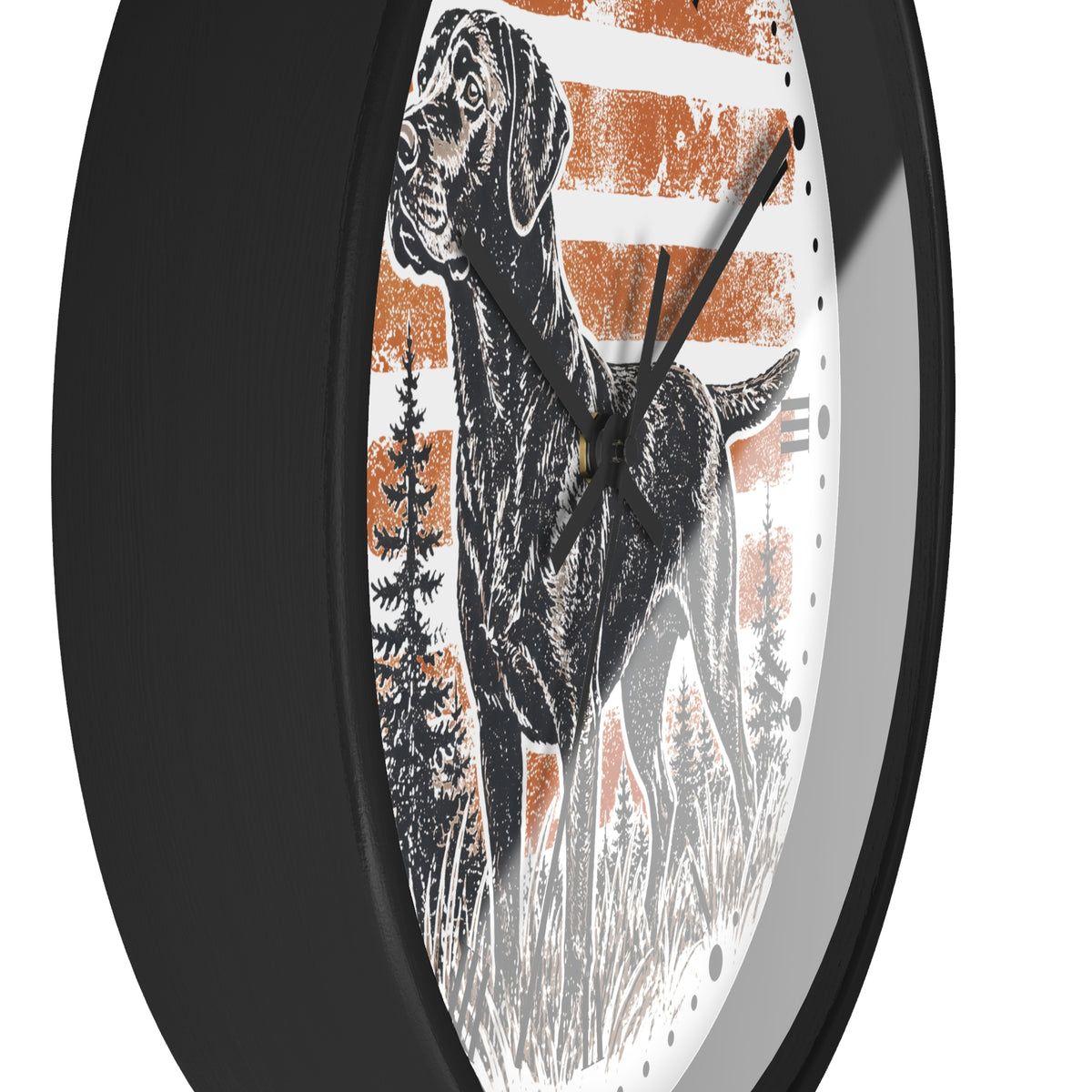 Round wall clock with a black frame and a white dial featuring a black-and-white dog illustration over distressed orange stripes and pine trees.