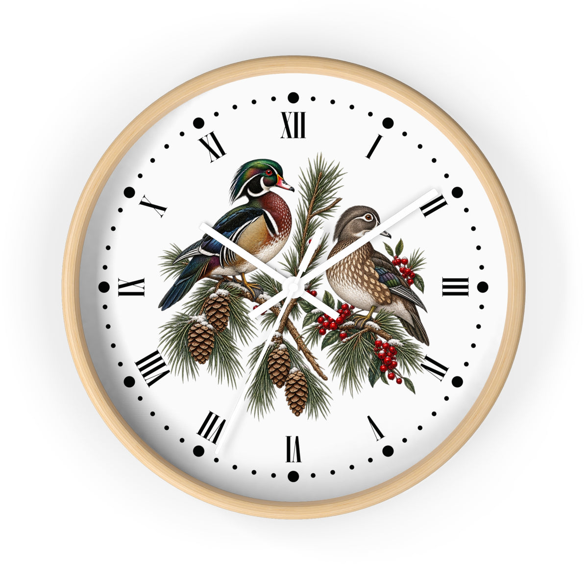 A round wall clock with a light natural wood frame, featuring a white face decorated with an illustration of two wood ducks perched on pine branches with pinecones and red berries, set against a plain white background.