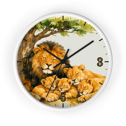 A round wall clock with a white frame and a printed illustration of a lion family under a tree. The design features a large adult lion with three cubs, black Arabic numerals for hours, and black clock hands on a light background.
