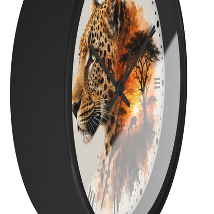 A round wall clock with a black frame and a printed face featuring a leopard profile blending into an African savanna sunset scene with trees and a bird.