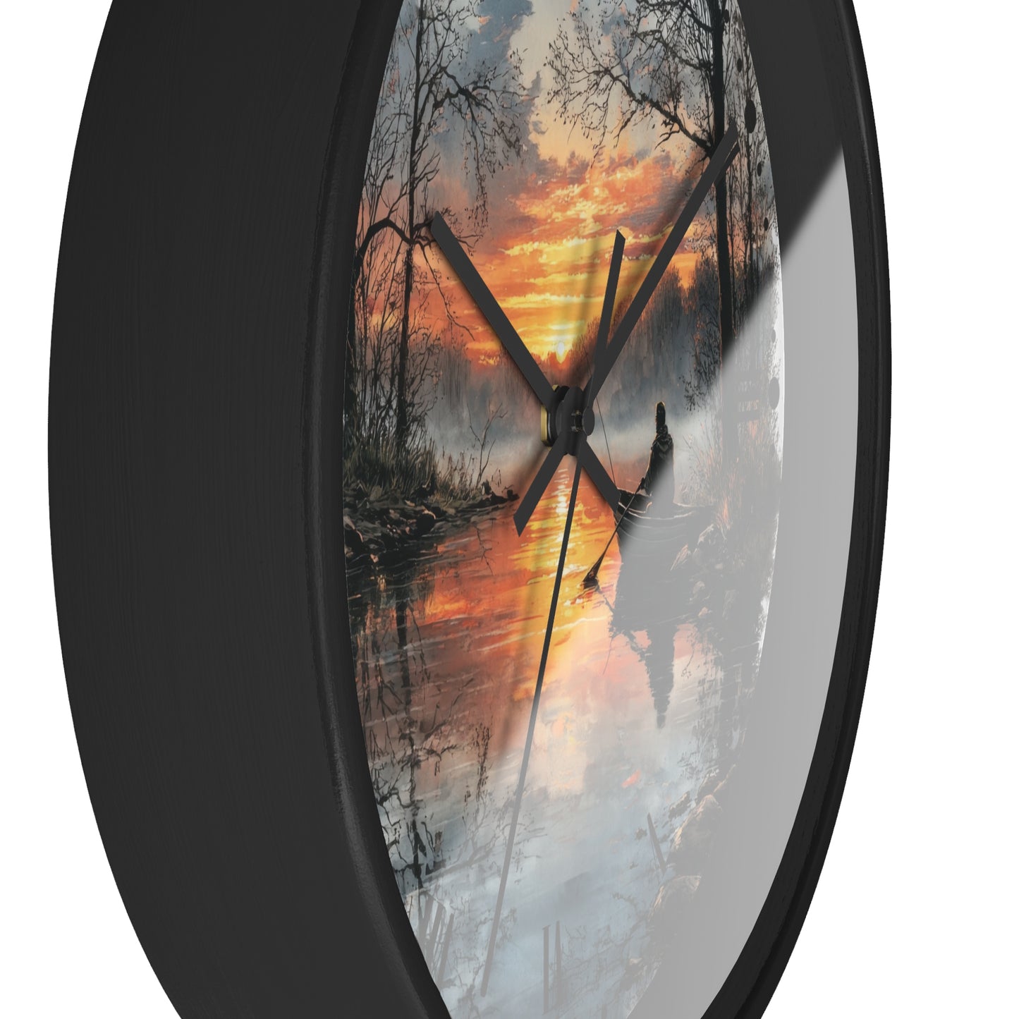 Round wall clock with a black frame and a printed scenic design of a misty forest at sunset, featuring black clock hands on a white background.