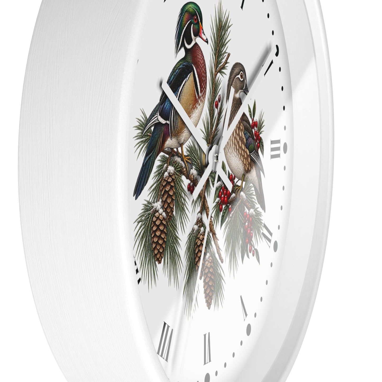 A white round wall clock featuring a detailed illustration of two wood ducks perched on pine branches with pinecones and red berries on the face.