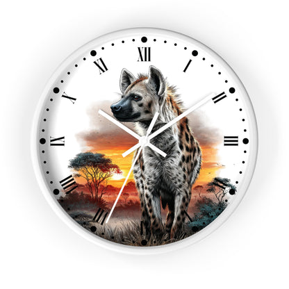 Round wall clock with a white frame and face, featuring a spotted hyena standing in an African savanna landscape at sunset, with black Roman numerals and white clock hands.