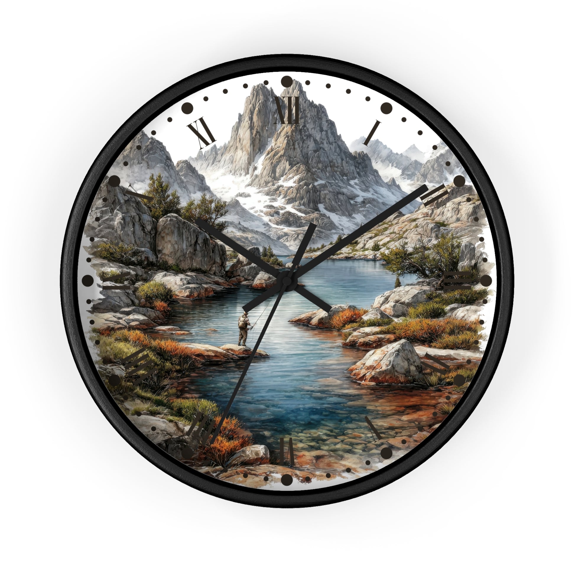 A round wall clock with a black frame and a scenic landscape print featuring a mountain range, rocky shoreline, blue water, and a small figure fishing. The clock face has black Roman numerals and black hands on a white background.