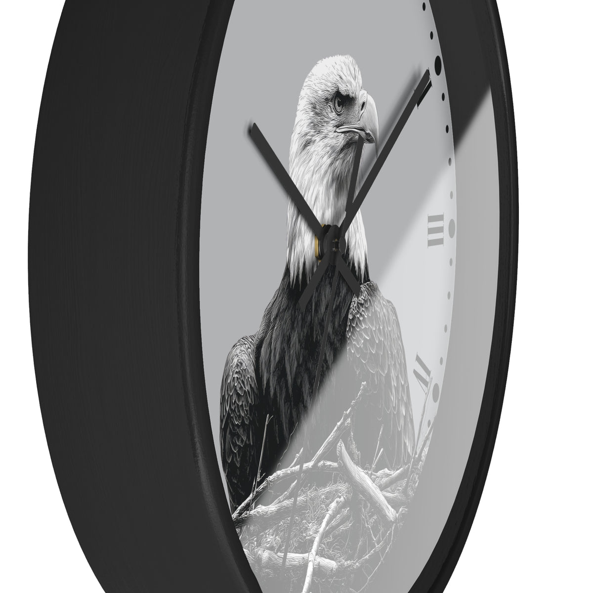 A round wall clock with a black frame and a monochrome photograph of a bald eagle on the face, with black hands and Roman numeral hour markers on a light gray background.