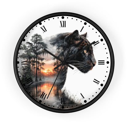 Round wall clock with a black frame and Roman numerals, featuring a split design: one half shows a black panther head, the other half shows a misty forest at sunset over water.