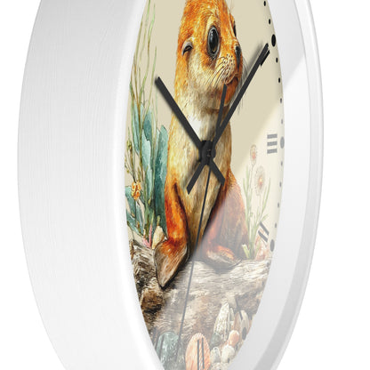 A white oval wall clock featuring a detailed illustration of a brown and orange seal pup on the face, with black hands and Roman numeral hour markers.
