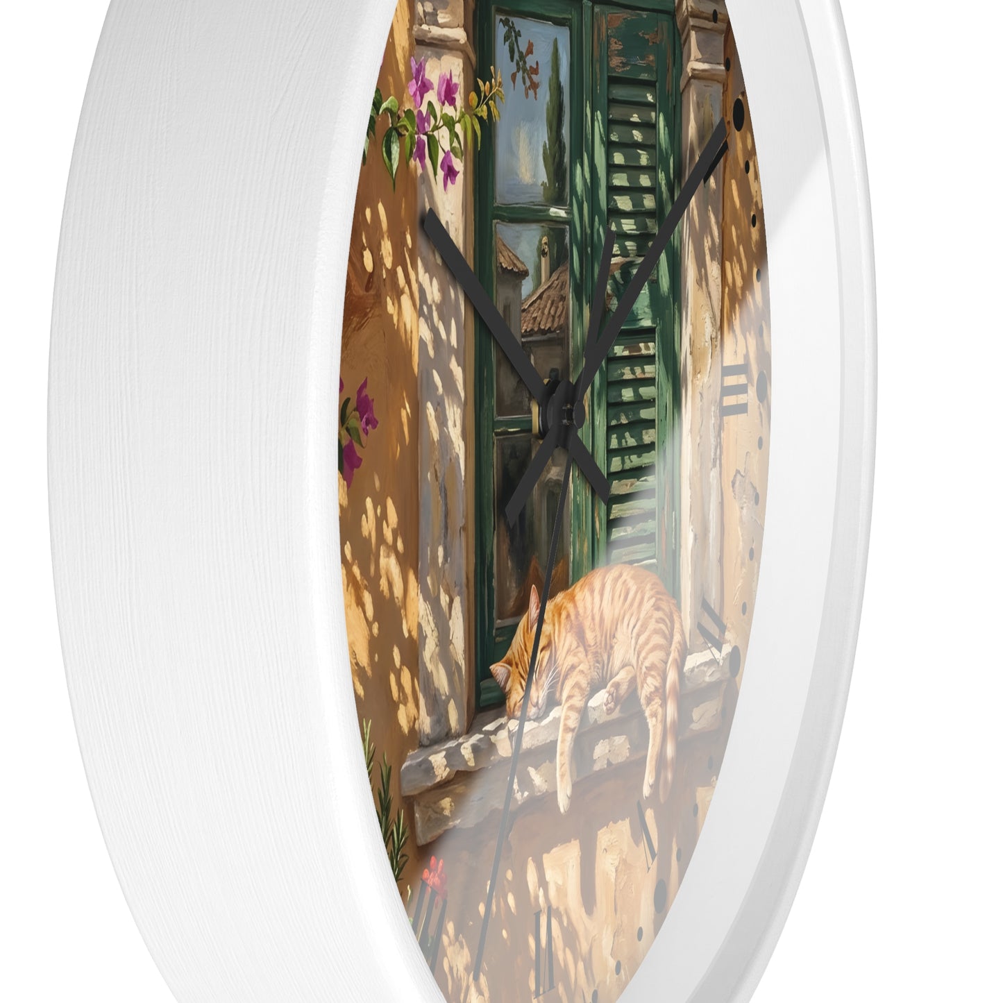 Oval wall clock with a white frame and a printed illustration of a sunlit courtyard scene featuring a green shuttered door, shadow patterns, and an orange tabby cat on a windowsill.