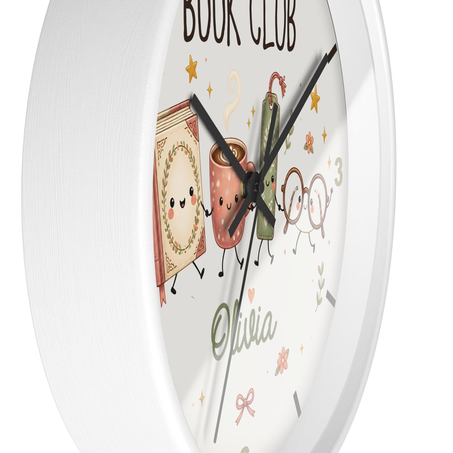 A round white wall clock with a whimsical book-themed face. The clock features cute illustrations of a book, a coffee mug, a green book, and glasses with the text 'BOOK CLUB' and the name 'Olivia' written in green script.