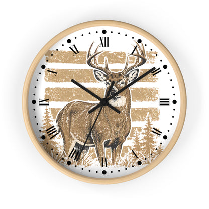 A round wall clock with a light wood frame, featuring a white face printed with a brown deer illustration, black Roman numerals, and a distressed tan striped background.