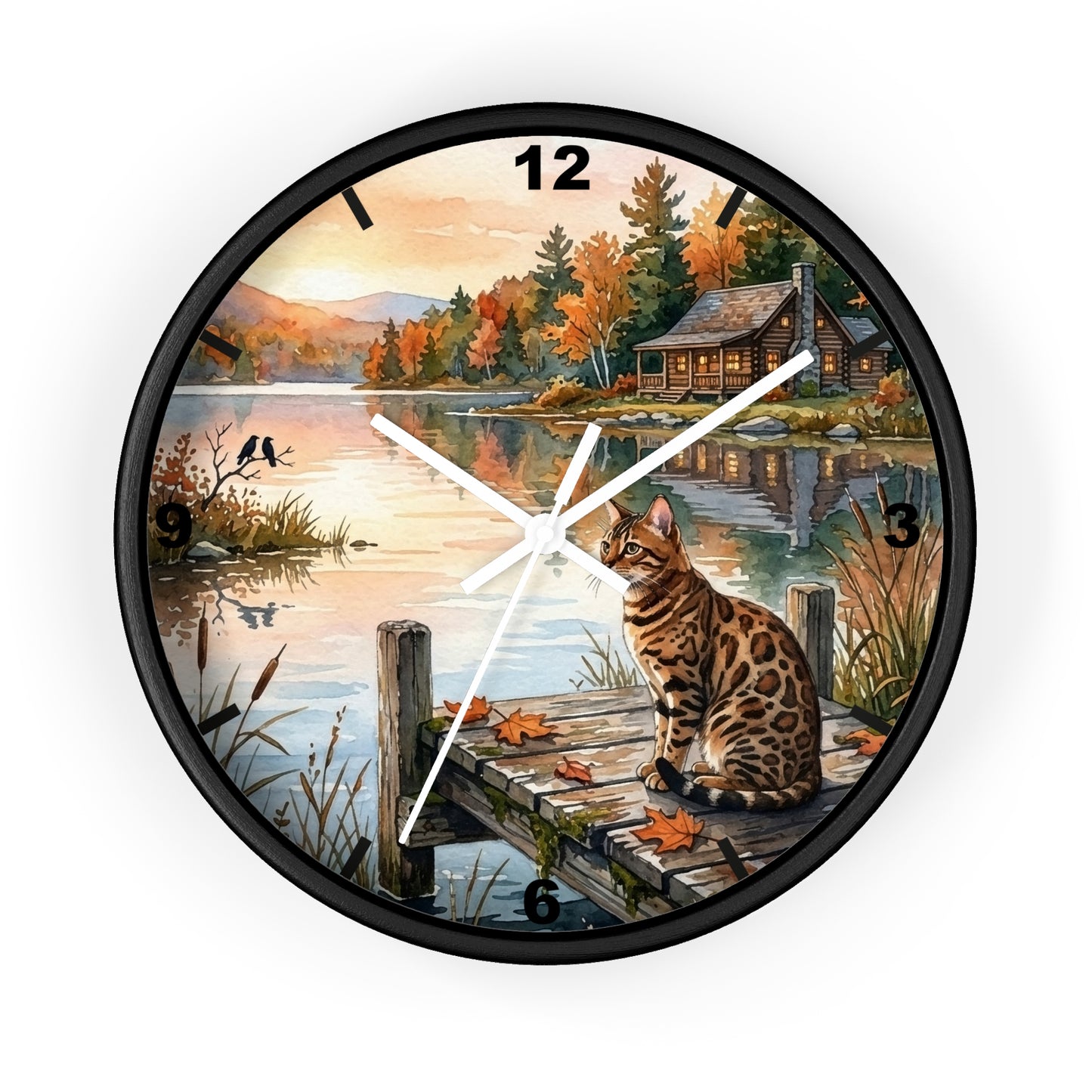 A round wall clock with a black frame and a scenic printed face showing a cat on a dock by a lake at sunset, with black numerals and white clock hands.