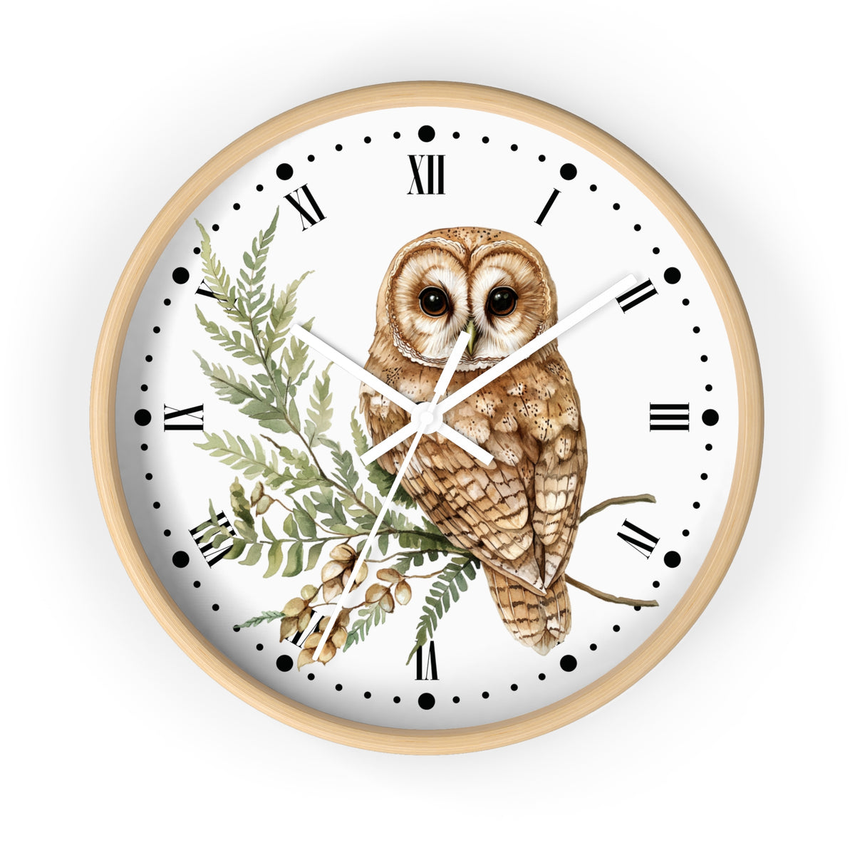 A round wall clock with a light natural wood frame, featuring a white face decorated with a detailed illustration of a brown owl perched on a branch with green leaves and acorns. The clock has black Roman numerals and white hands.
