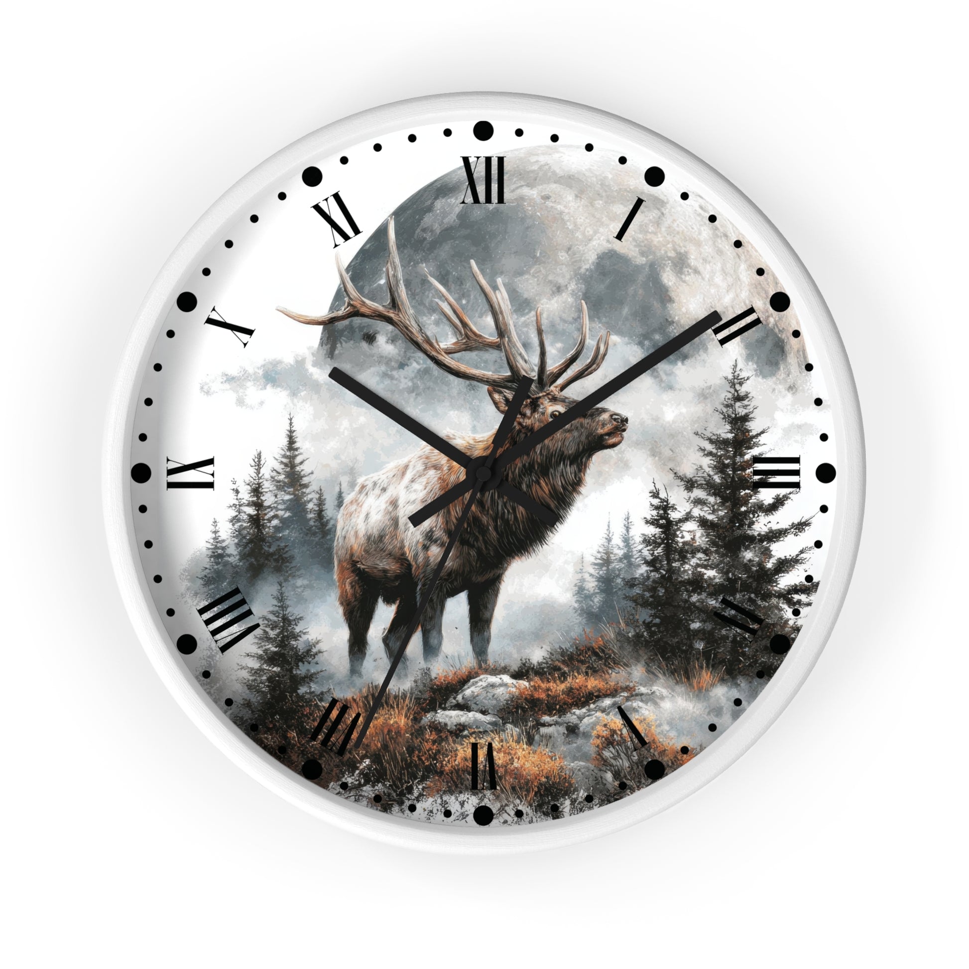 A round wall clock with a white frame and a scenic print of a large deer with antlers standing in a misty forest under a full moon. The clock face has black Roman numerals, black dot hour markers, and black clock hands.